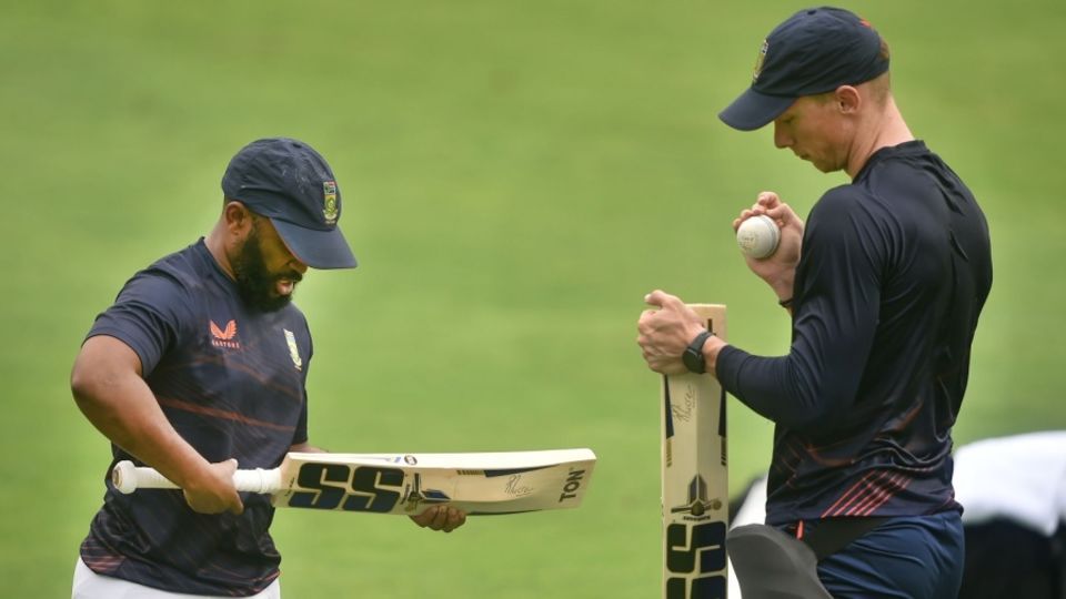 Temba Bavuma and Rassie van der Dussen inspect their bats at training