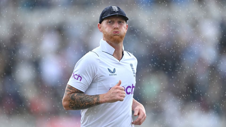Ben Stokes runs off as the rain comes down