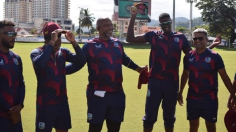 Brandon King, Keacy Carty, head coach Phil Simmons, Jason Holder and batting coach Monty Desai during practice