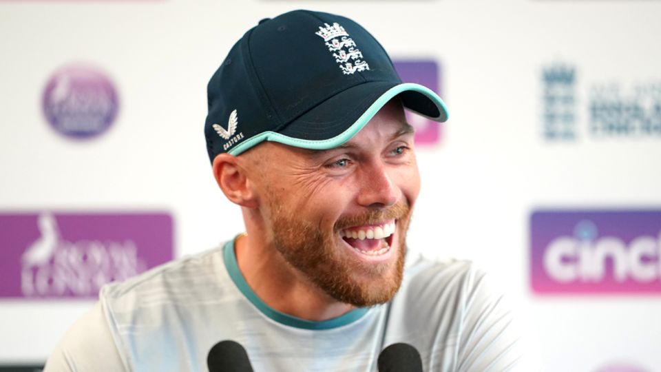 Phil Salt laughs while speaking to the press