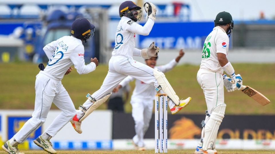 The Sri Lanka players celebrate Imam-ul-Haq's wicket