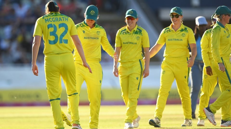 Jess Jonassen has a foot-tap with Tahlia McGrath, who was cleared to play despite testing positive, after a catch to dismiss Shafali Verma