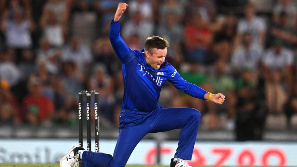 Mason Crane celebrates taking the wicket of Alex Davies