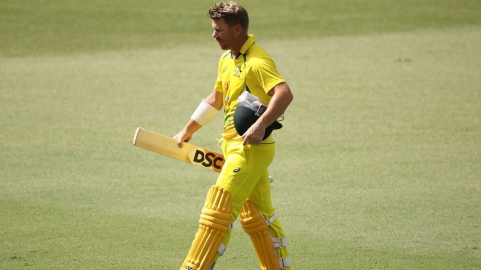 David Warner walks back dejected after being dismissed by Matt Henry