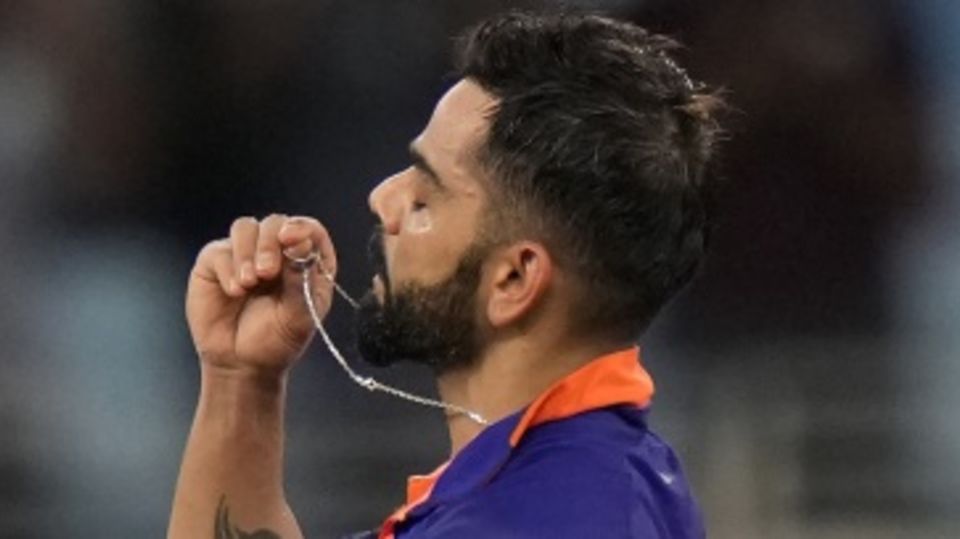 Virat Kohli celebrates his maiden T20I hundred