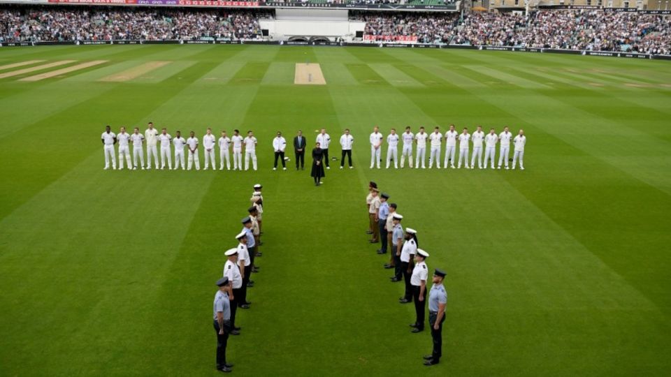 The teams line up for a minute's silence in memory of Queen Elizabeth II