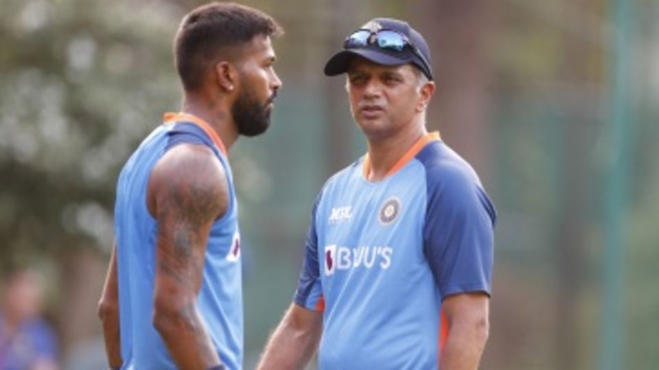 Hardik Pandya chats with India head coach Rahul Dravid during training