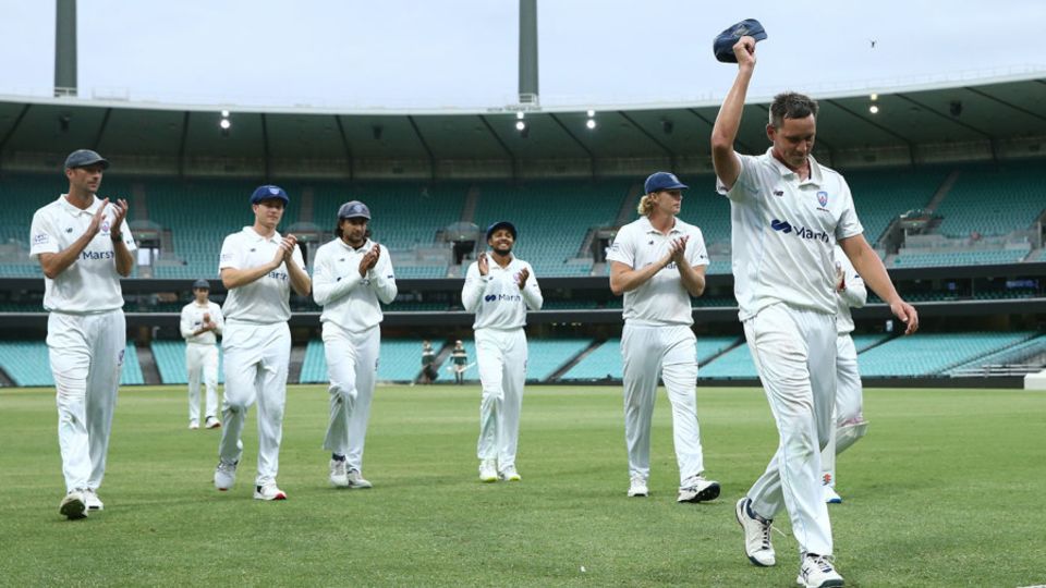 Chris Tremain walks off the SCG after taking five wickets against Tasmania