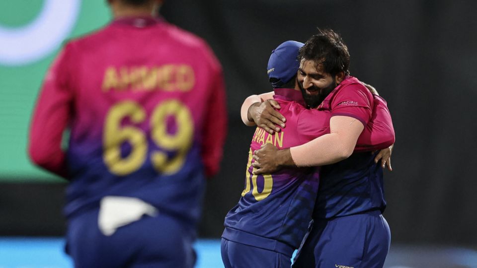Muhammad Waseem gets a hug from his captain