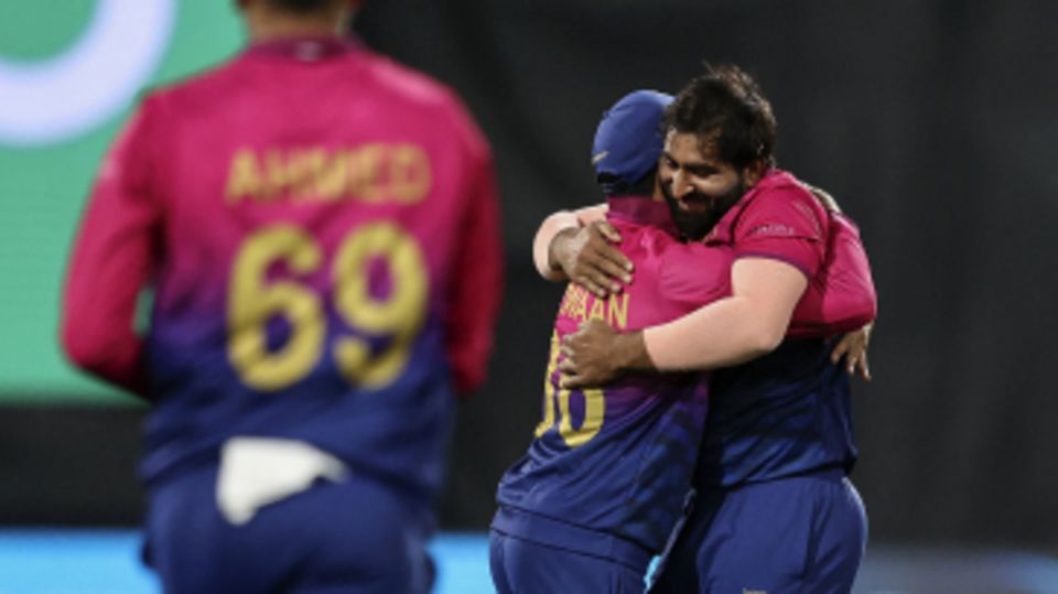 Muhammad Waseem gets a hug from his captain