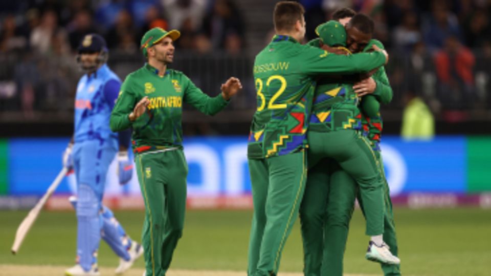 Lungi Ngidi is mobbed by his team-mates