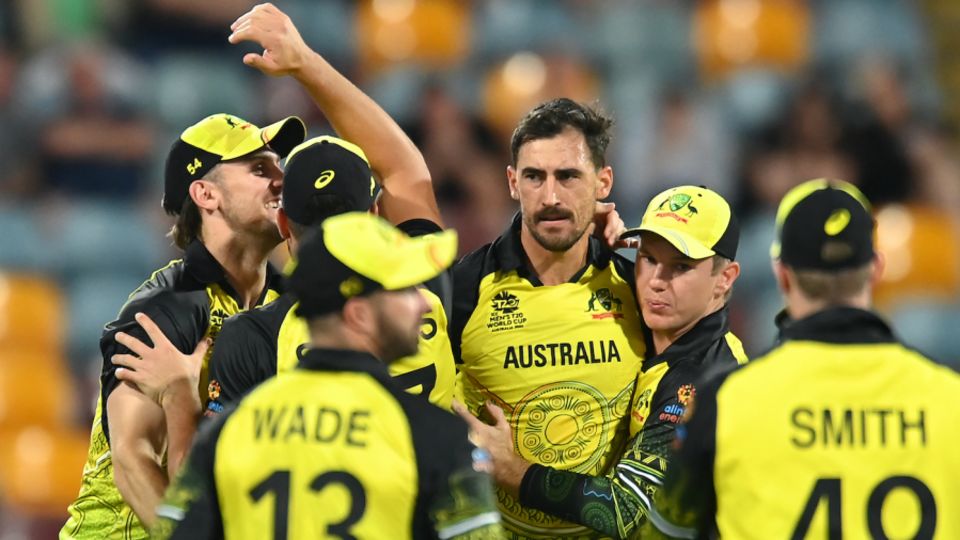 Mitchell Starc with his team-mates after removing George Dockrell