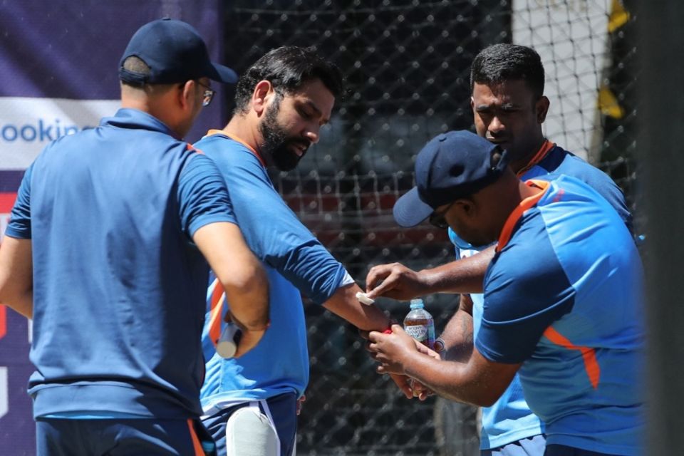Rohit receives medical attention after being hit on the forearm