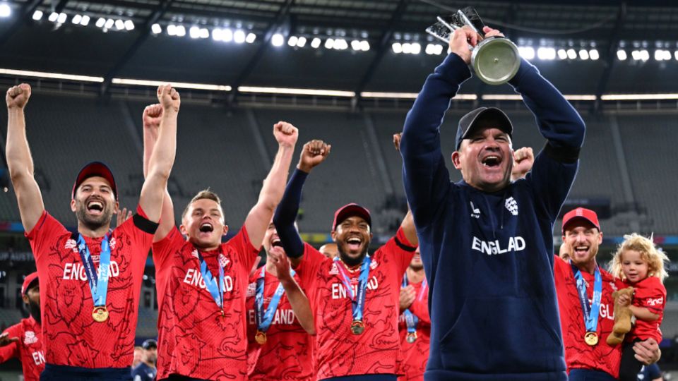 Matthew Mott celebrates with the side after England clinched the trophy