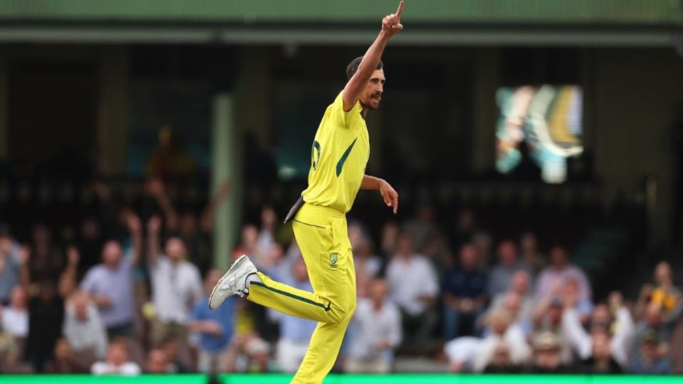 Mitchell Starc celebrates taking two in the first over