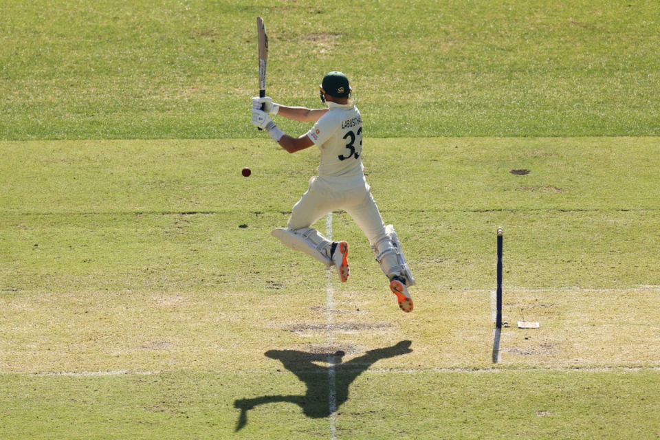 Marnus Labuschagne jumps over to get under the ball