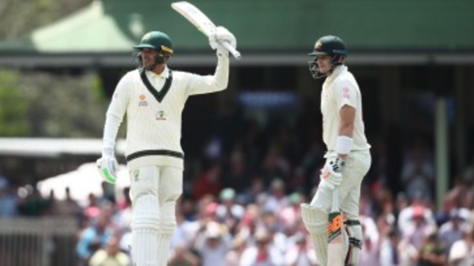 Usman Khawaja raises the bat for 150