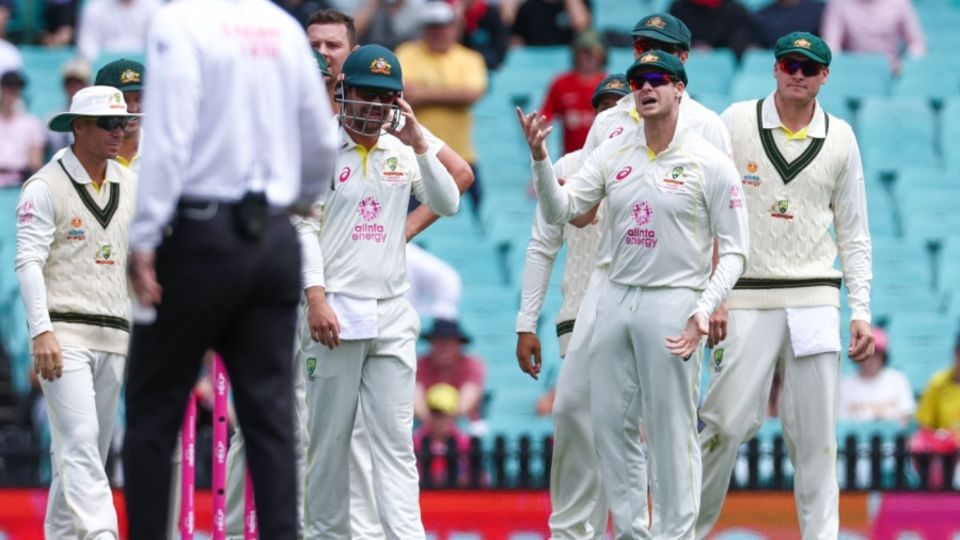 Steven Smith reacts after the third umpire ruled that he hadn't caught Dean Elgar cleanly in the slips