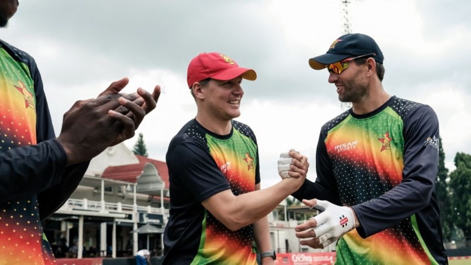 Gary Ballance receives his Zimbabwe cap from captain Craig Ervine