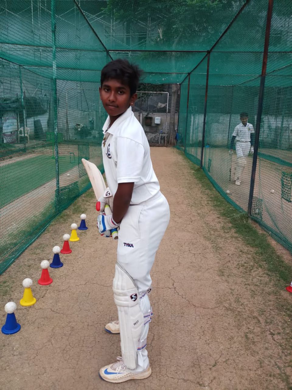 A young Trisha in the nets