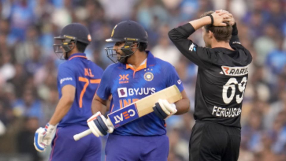 Rohit Sharma and Shubman Gill trot across for a run as Lockie Ferguson wonders if there's a way back for New Zealand