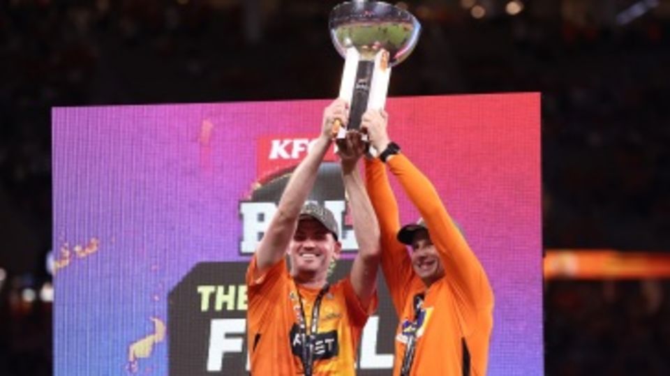 Ashton Turner and Adam Voges hold the trophy aloft