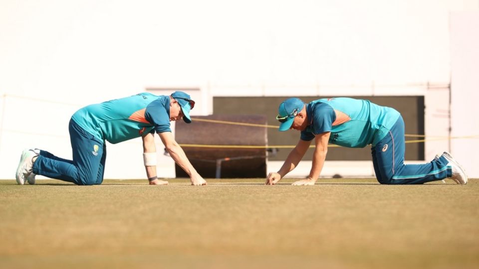 Steve Smith and David Warner inspect the pitch during a training session