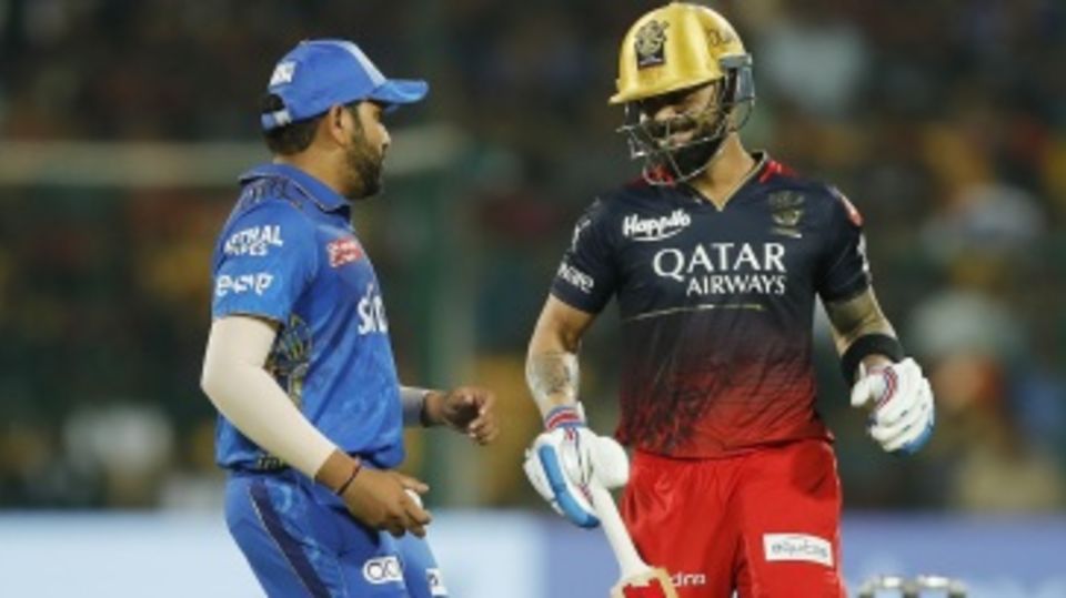 Virat Kohli and Rohit Sharma share a light moment on the field
