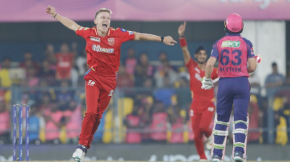 Nathan Ellis celebrates after sending Jos Buttler back caught and bowled
