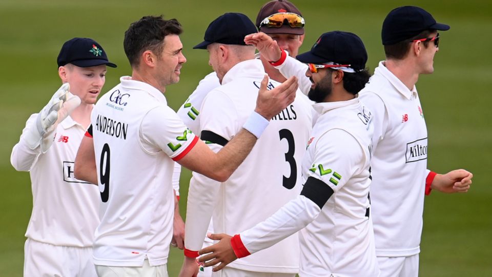 James Anderson is congratulated by Saqib Mahmood
