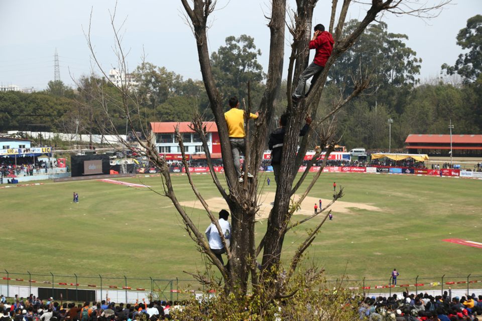 In high places: fans in Kirtipur get a bird's eye view of the action in the Nepal-UAE World Cup League 2 match in 2023