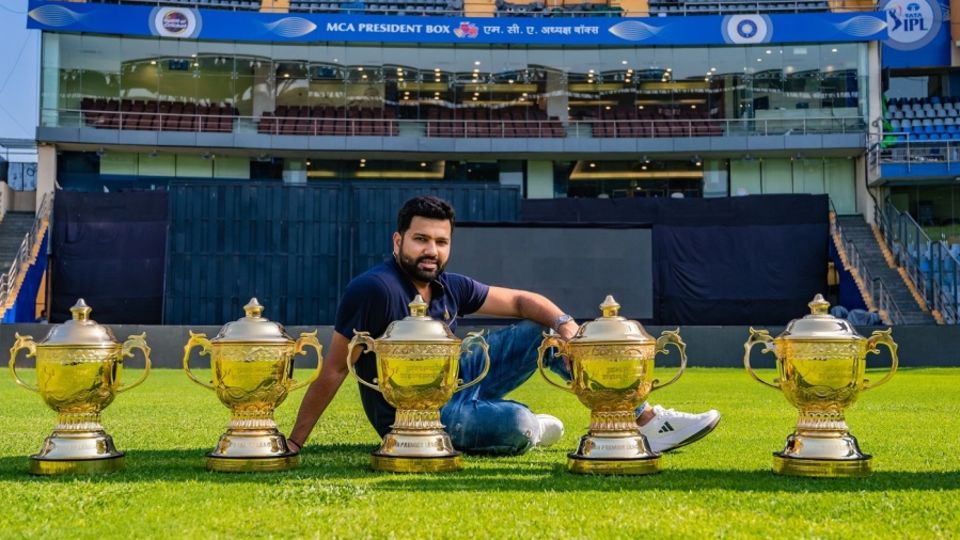 Rohit Sharma poses with the five IPL trophies he has won as Mumbai Indians captain