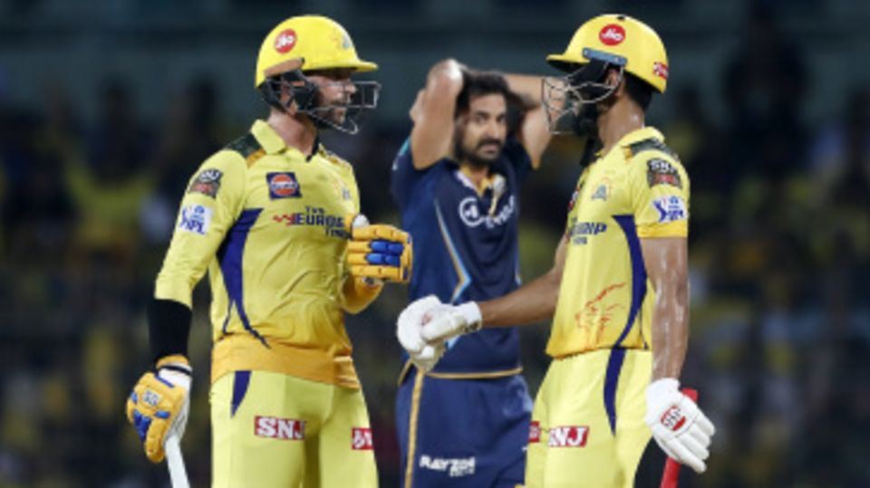 Devon Conway and Ruturaj Gaikwad have a chat while a disappointed Mohit Sharma watches on