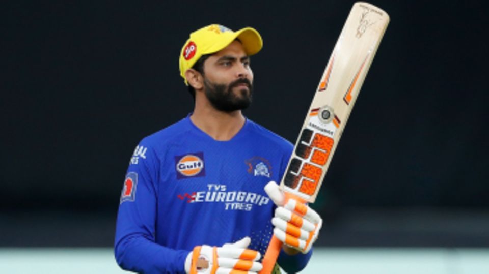 Ravindra Jadeja walks out for a hit before the toss