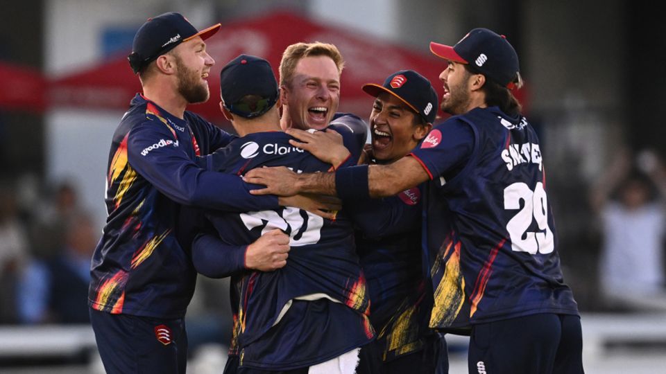 Simon Harmer is mobbed by his team-mates after completing his hat-trick