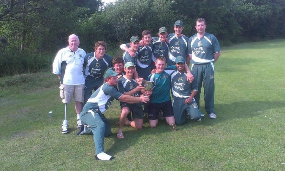 Labuschagne (kneeling, second from right) with his Plymouth team-mates after the club won the Devon area T20 title in 2013