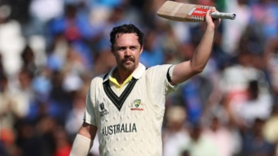 Travis Head celebrates his century