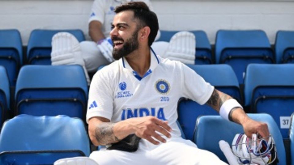 Virat Kohli shares a light moment before walking out