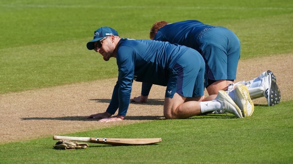 Brendon McCullum and Jonny Bairstow inspect the pitch