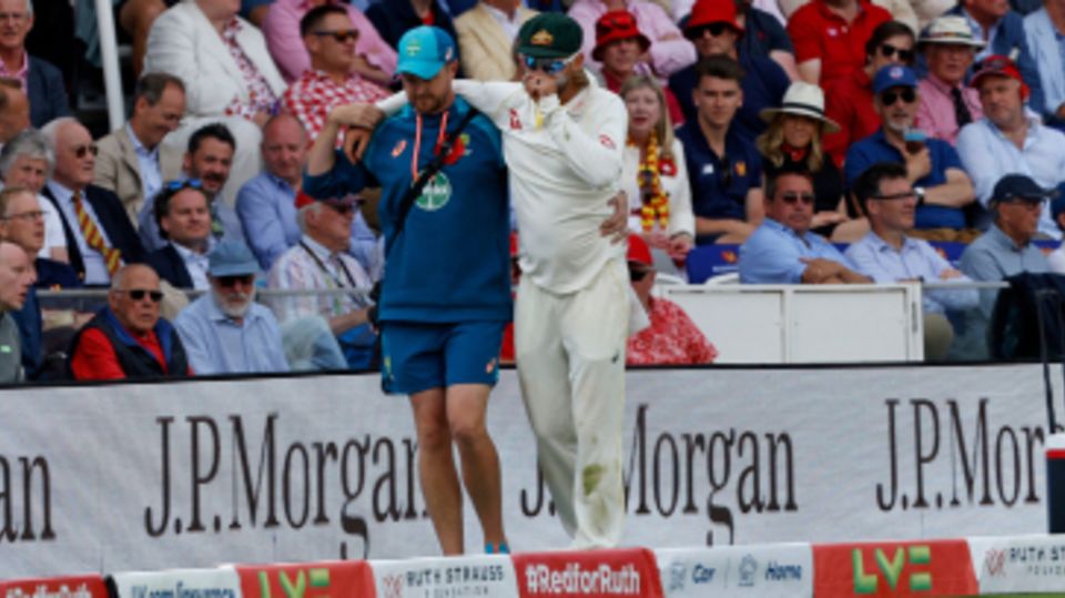 Nathan Lyon had to be helped around the boundary by the physio
