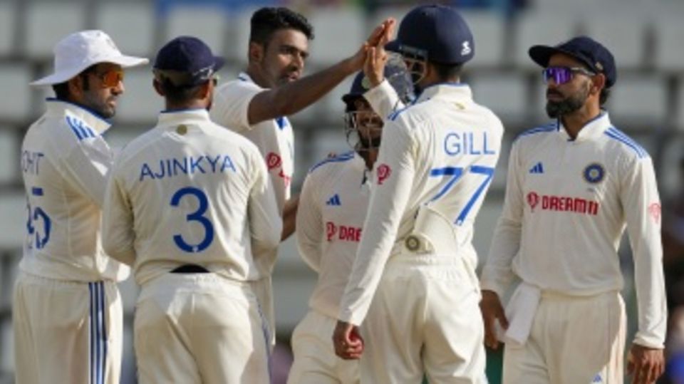 R Ashwin is mobbed by his team-mates