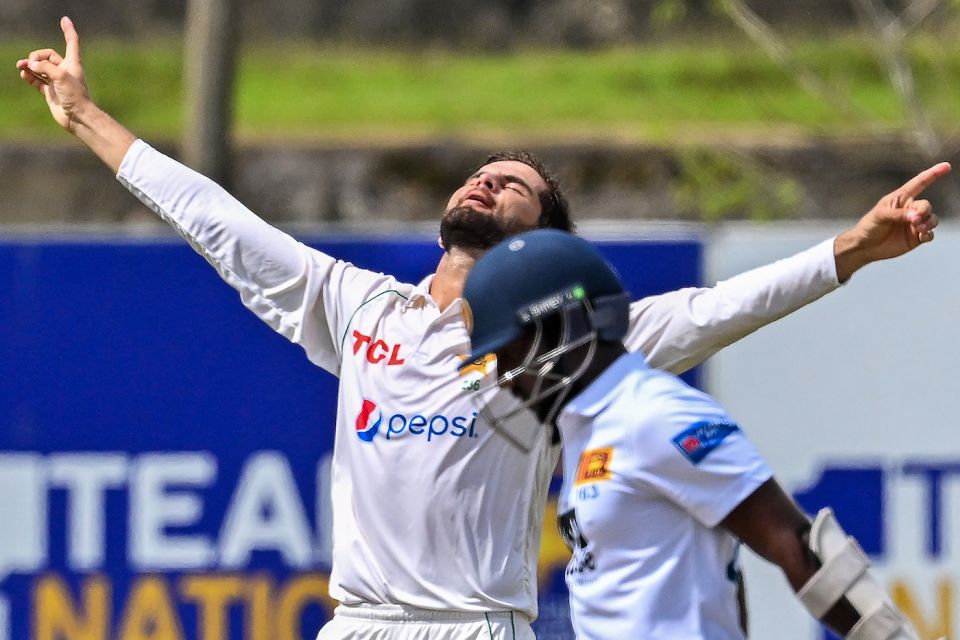 Nishan Madushka walks back as Shaheen Afridi strikes his trademark pose