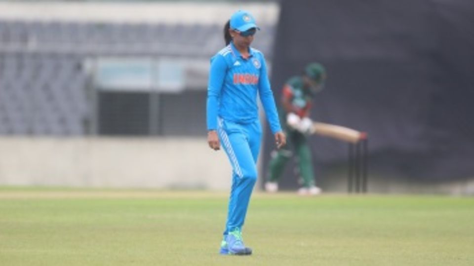 Harmanpreet Kaur walks to her fielding position