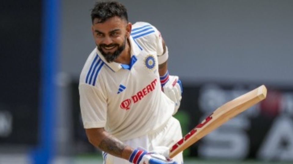 Virat Kohli takes a bow after scoring his 29th Test century