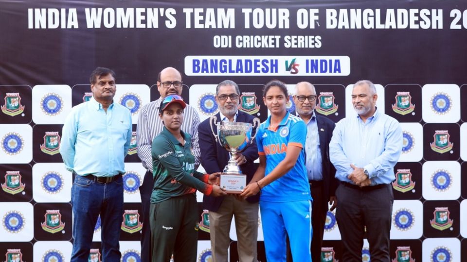 Nigar Sultana and Harmanpreet Kaur sport far-from-pleased expressions when receiving the trophy