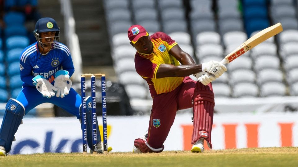 Rovman Powell swings at the ball