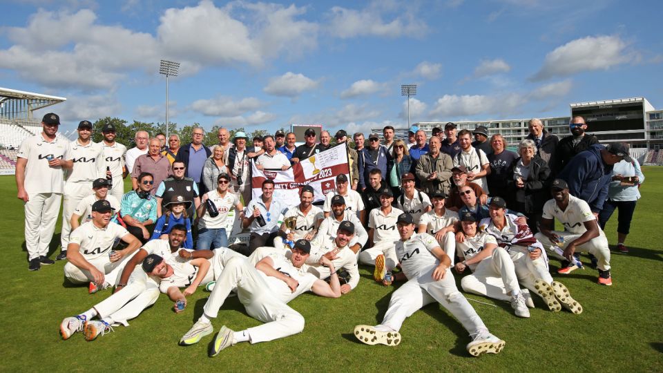 Surrey and their supporters pose with the County Championship trophy
