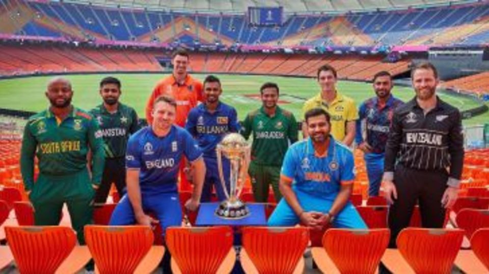 The 10 team captains pose with the World Cup trophy
