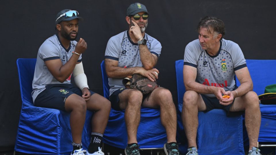 Temba Bavuma works out the team's plans with the coaching staff