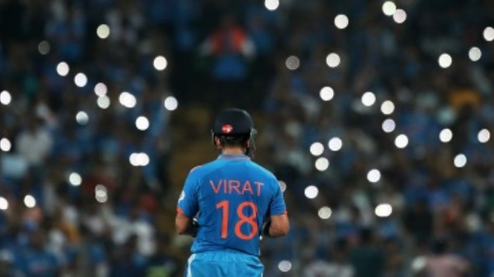 Virat Kohli soaks in the applause after his fifty